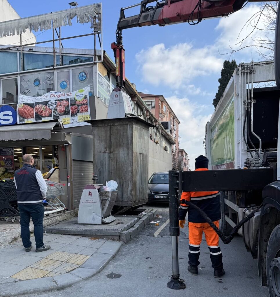 A garbage can being lifted